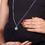 A 925 sterling silver harmony ball pregnancy necklace with a long chain, showing its detailed round chime pendant.