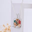 Front view of the Enamelled Chamudamaa 925 Silver Pendant, showcasing its vibrant mina work and diamond details.