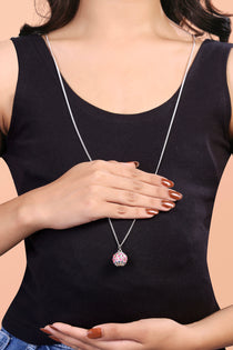 Front view of a 925 sterling silver harmony ball bola necklace, a round pendant for expecting mothers on a long chain.