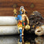 Front view of the 925 silver Shiv and Hanumanji pendant with vibrant blue and red Mina work on an oxidized finish.
