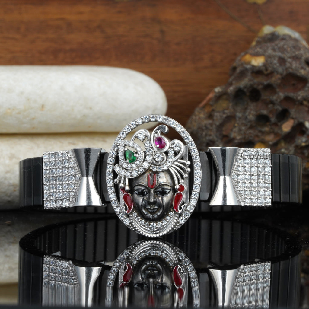 Detailed front view of the 925 silver Shreenathji bracelet, highlighting the antique oxidised finish on the Krishna pendant.