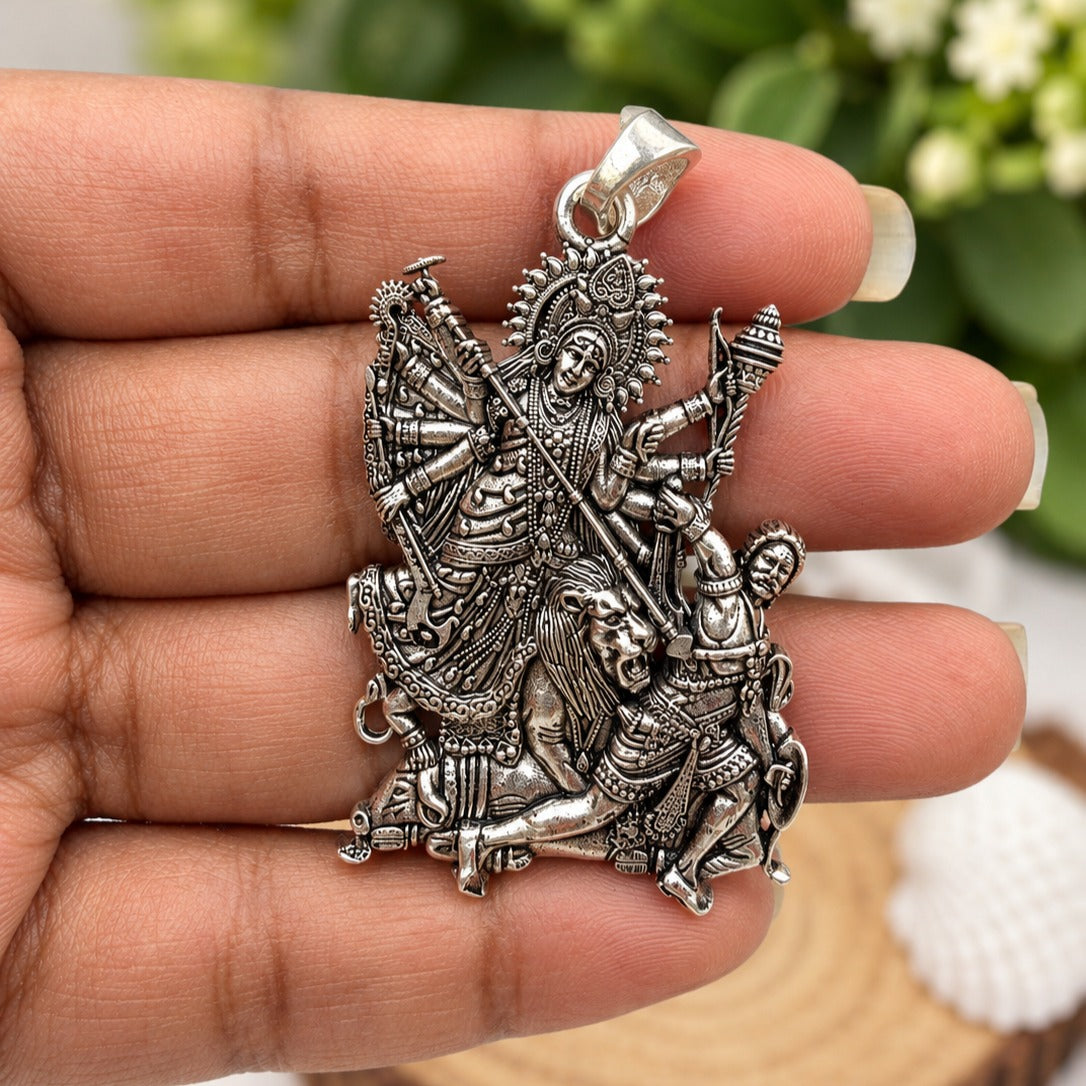 Antique Silver Durga Pendant in Hand-crop.jpg