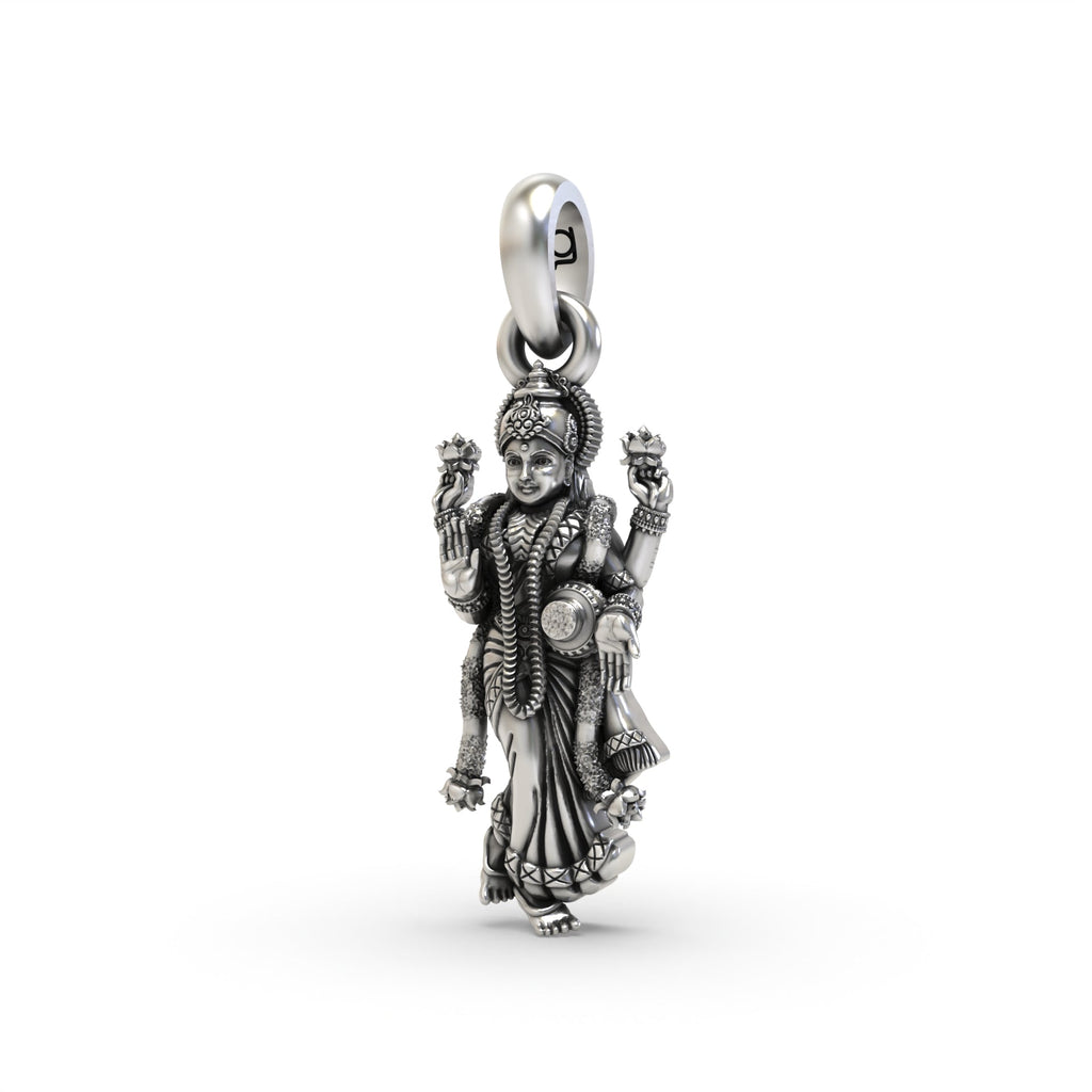 An angled profile of the Silver Standing Lakshmi Pendant, highlighting its dimensional craftsmanship and antique look.
