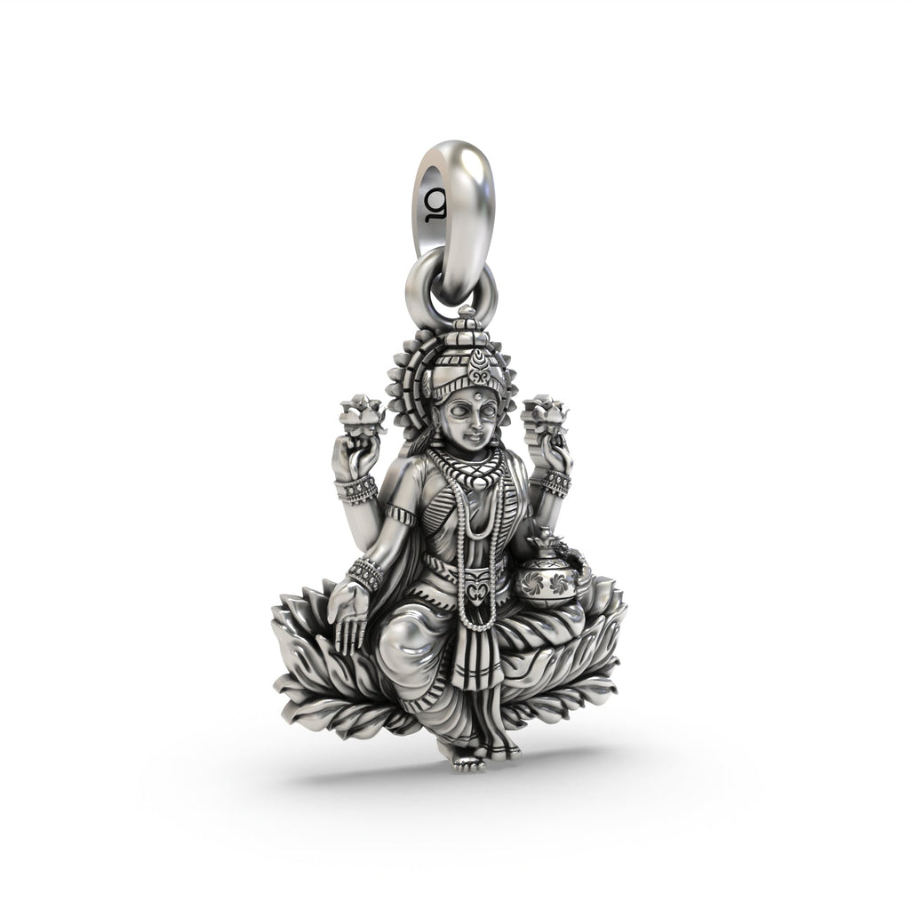 An angled view of the 925 sterling silver Lakshmi pendant, showing its depth and the oxidized lotus flower details.