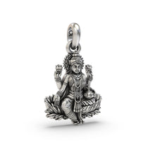 An angled view of the 925 sterling silver Lakshmi pendant, showing its depth and the oxidized lotus flower details.