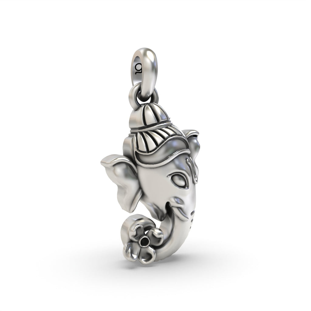 Angled view of the Silver Ganesh Face Pendant, displaying the depth of the carving on the 925 sterling silver.