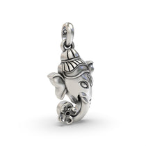 Angled view of the Silver Ganesh Face Pendant, displaying the depth of the carving on the 925 sterling silver.