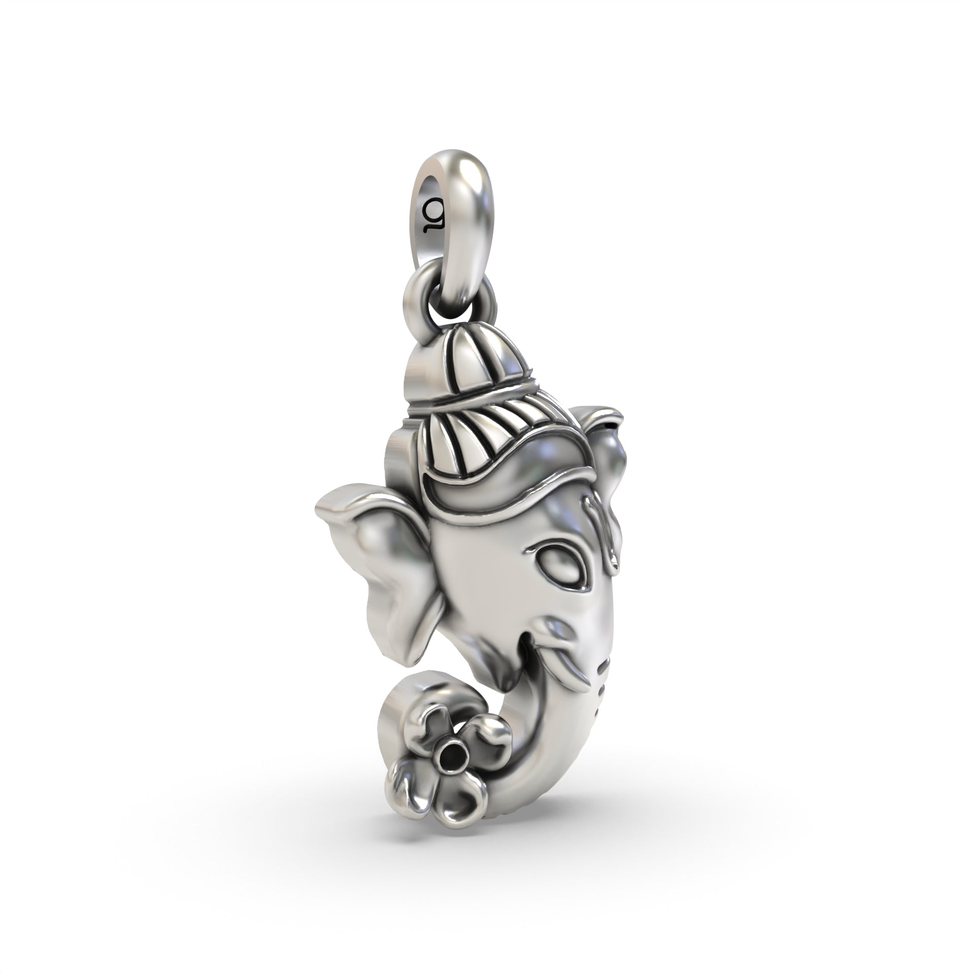 Angled view of the Silver Ganesh Face Pendant, displaying the depth of the carving on the 925 sterling silver.