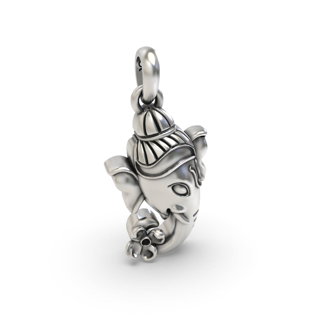 Macro detail shot of the Silver Ganesh Face Pendant, focusing on the texture of the oxidized 925 silver.