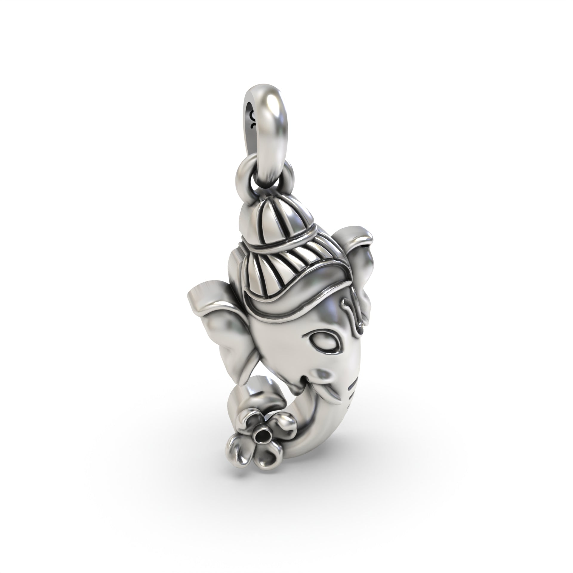 Macro detail shot of the Silver Ganesh Face Pendant, focusing on the texture of the oxidized 925 silver.