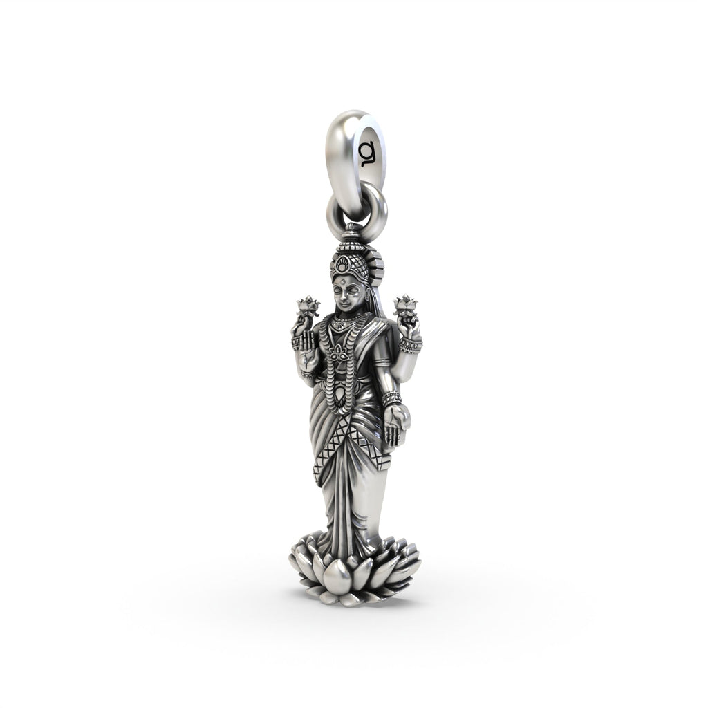 Angled view of the Lakshmi silver pendant, showing the intricate details and oxidized finish on the sacred figure.