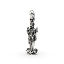 Angled view of the Lakshmi silver pendant, showing the intricate details and oxidized finish on the sacred figure.
