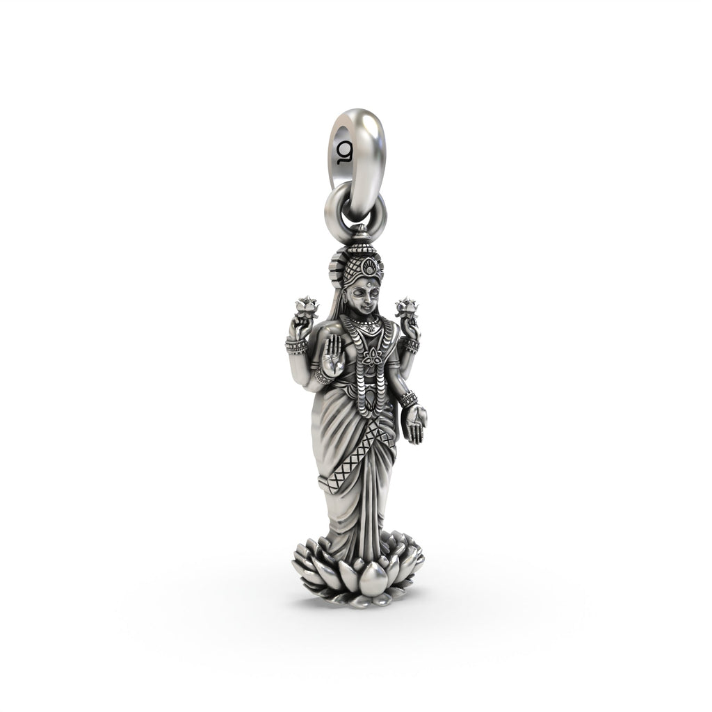 Close-up of the Lakshmi on lotus silver pendant, highlighting the antique oxidized texture and fine craftsmanship.