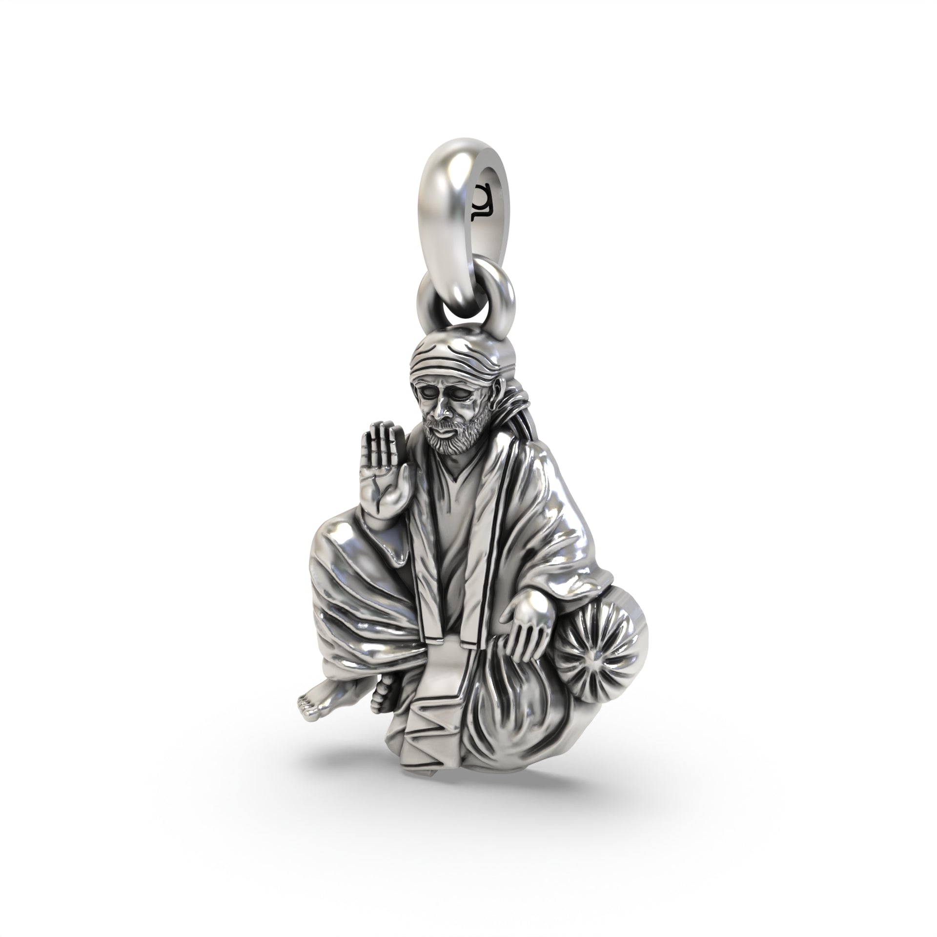 An angled side profile of the religious Sai Baba silver pendant, showcasing its intricate details and sterling silver
