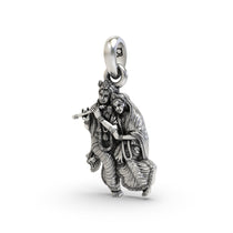 Angled view of the silver Radha Krishna pendant, highlighting the depth and intricate craftsmanship of the design.