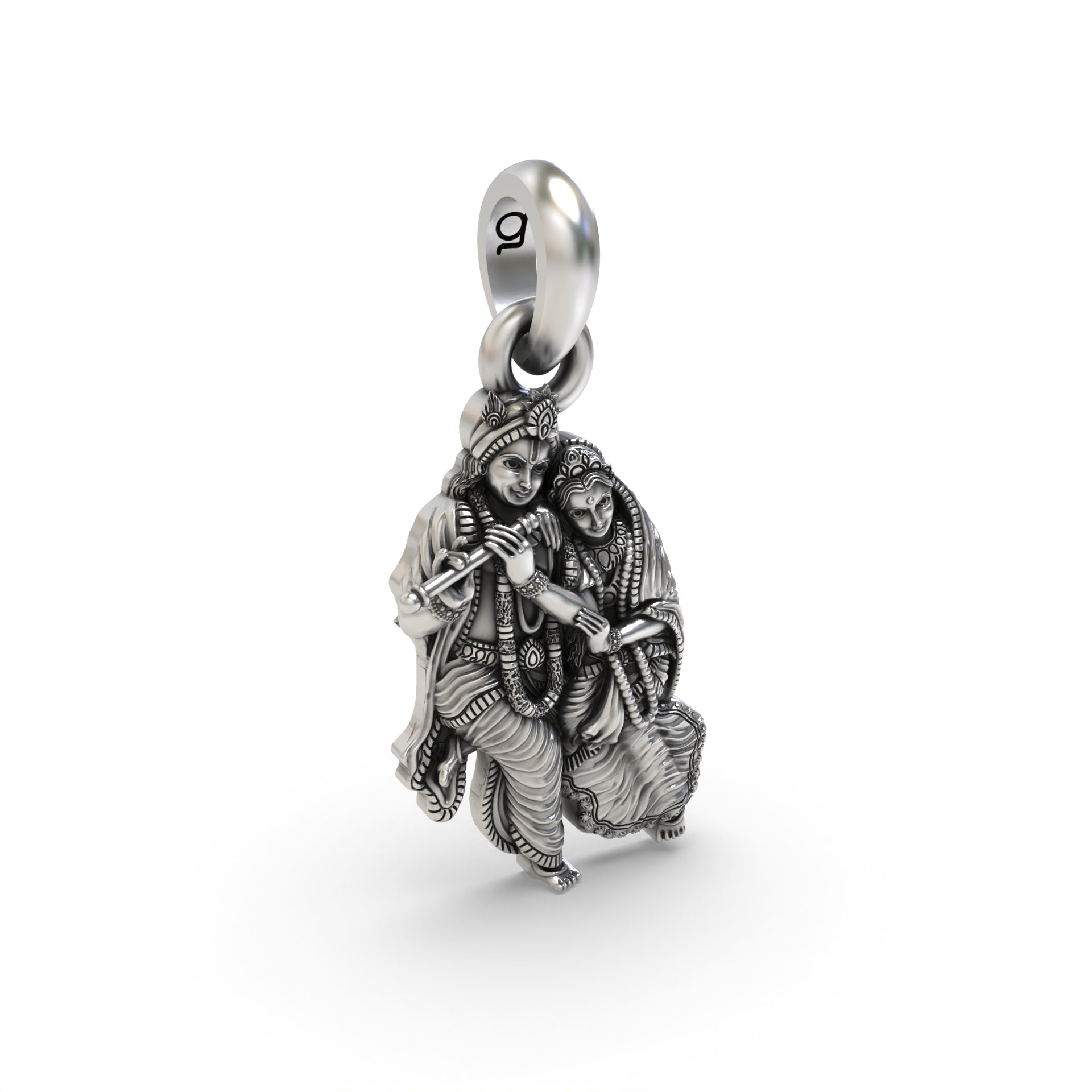 The silver Radha Krishna pendant held in hand to show its scale and hollow back design for lightweight comfort.