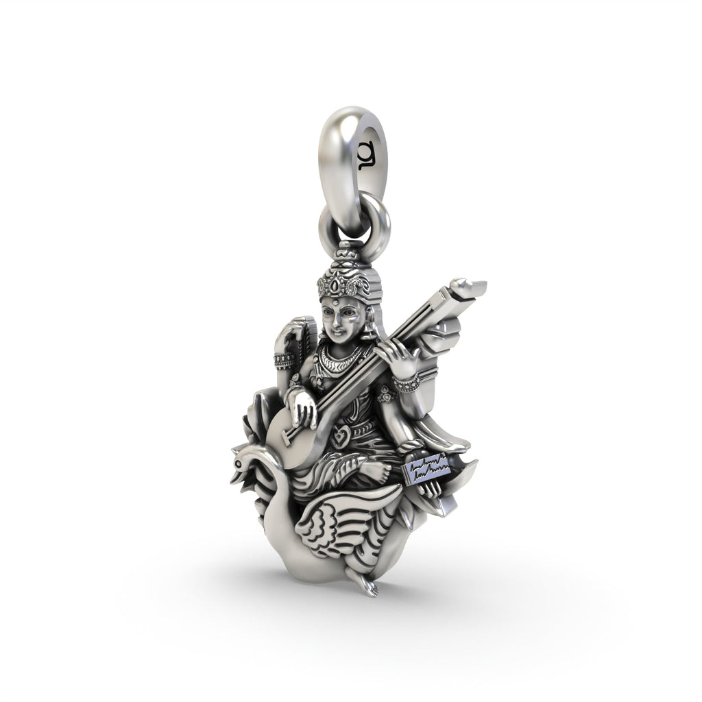Angled profile of the oxidized sterling silver Saraswati Maa pendant, showing the depth and detailed craftsmanship.