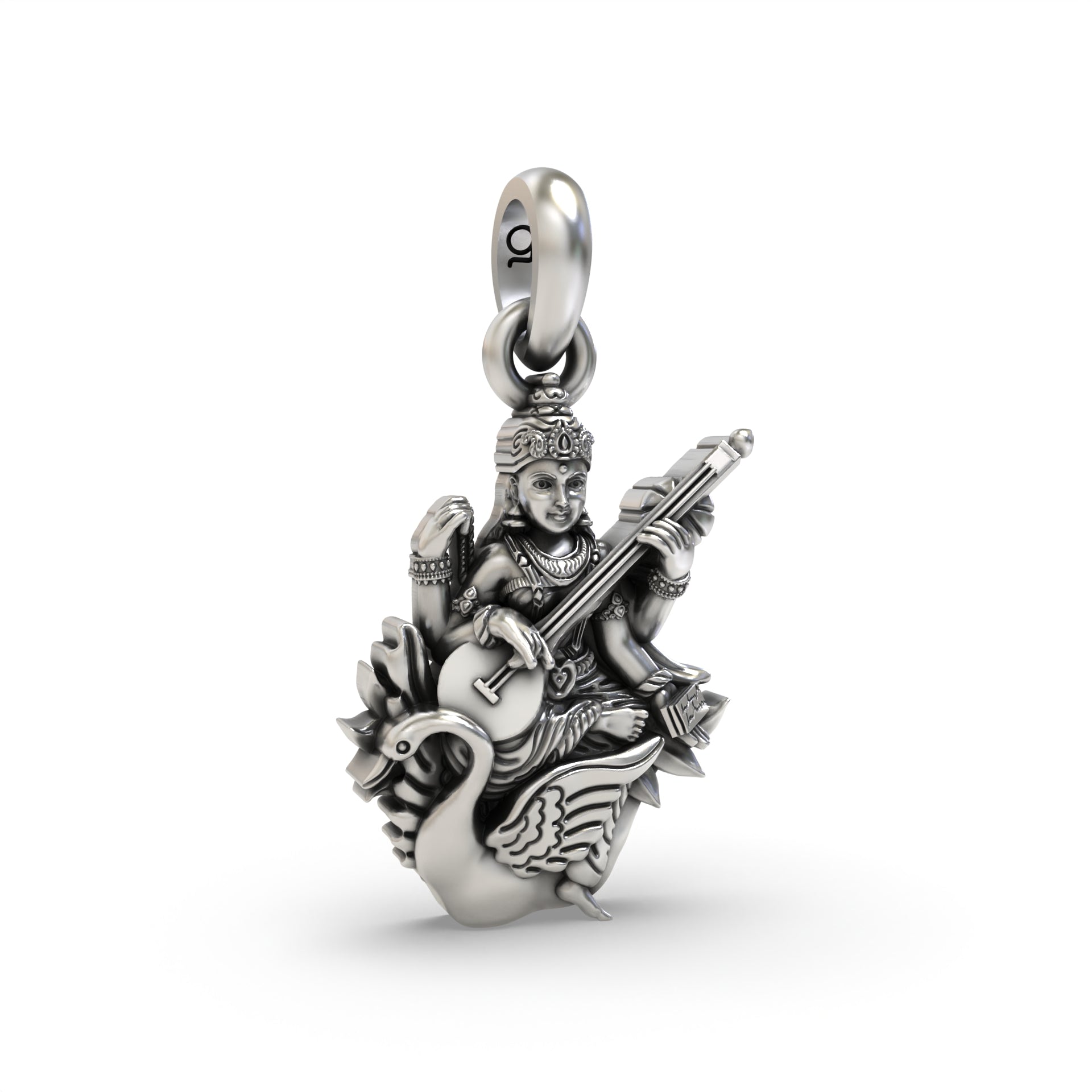A detailed close-up of the sterling silver Saraswati Maa pendant, highlighting the antique oxidized finish on the carving.