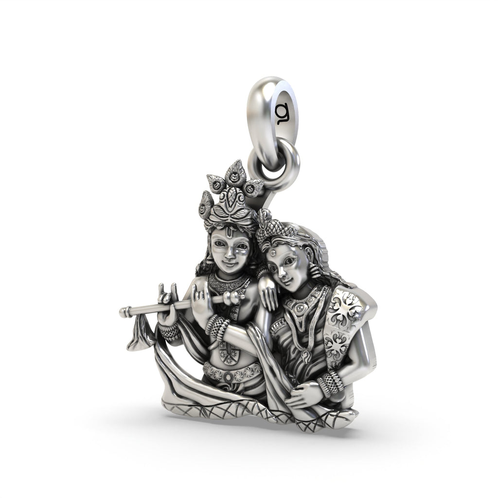 A detailed close-up of the Radha Krishna pendant showing the divine figures and antique oxidized 925 silver finish.