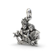A detailed close-up of the Radha Krishna pendant showing the divine figures and antique oxidized 925 silver finish.