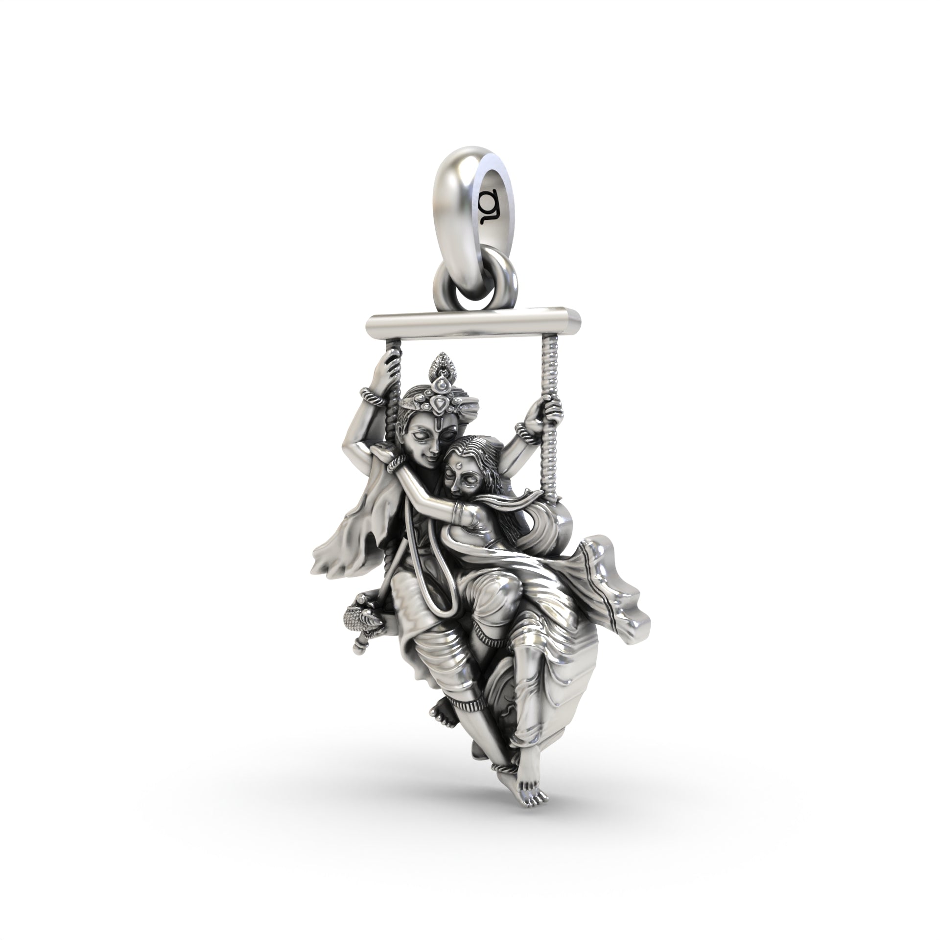 Angled profile of the oxidized Radha Krishna on a swing pendant, highlighting the fine craftsmanship and hollow back design.