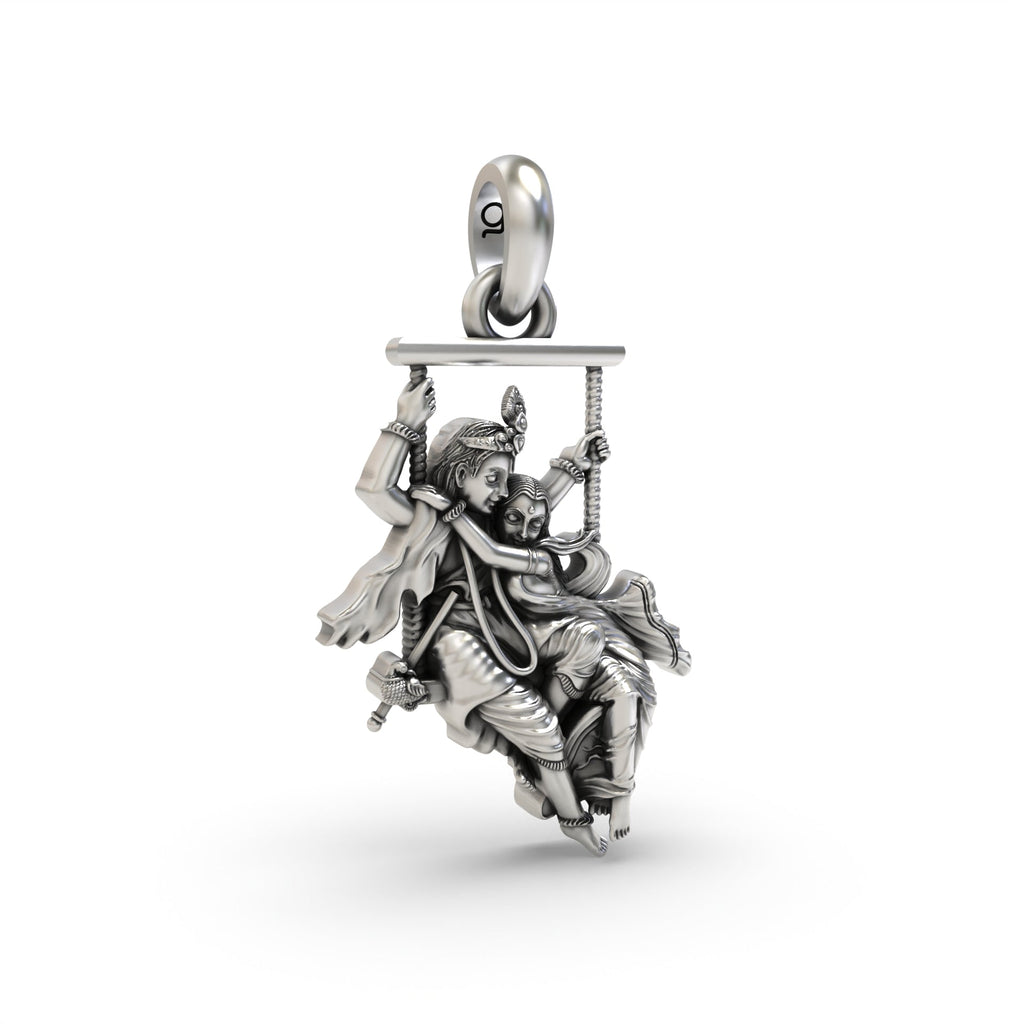 Close-up detail of the 925 silver Radha Krishna on a swing pendant, focusing on the antique oxidized finish and expressions.