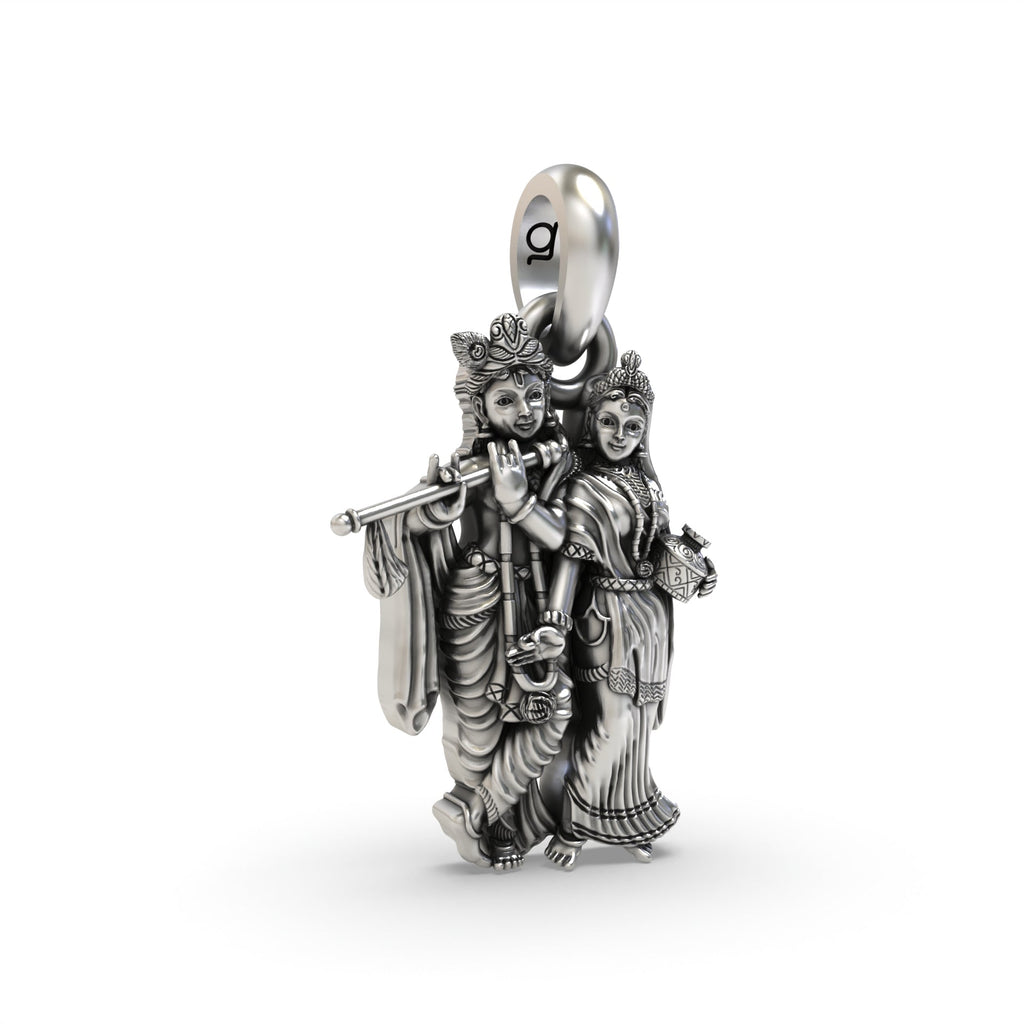 A detailed close-up of the oxidized Radha Krishna silver pendant, showcasing the beautiful features of the holy figures.