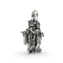 A detailed close-up of the oxidized Radha Krishna silver pendant, showcasing the beautiful features of the holy figures.