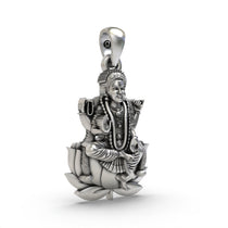 A close-up of the Bala Tripurasundari goddess pendant, highlighting the antique oxidized finish on the silver.