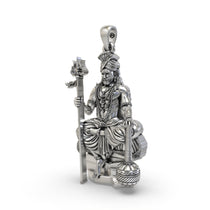 An angled perspective of the men's sterling silver Muniswarar locket, highlighting its oxidized finish and depth.