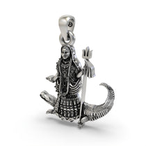 The lightweight 925 sterling silver Khodiyar Maa pendant held in hand to show its scale and hollow back design for comfort.