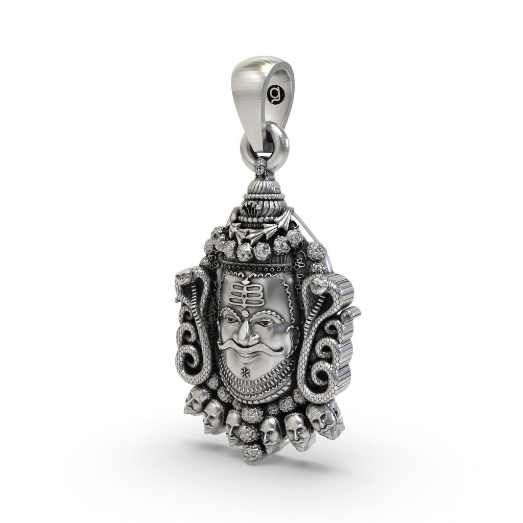 Angled shot of the sterling Silver Mahakal Pendant, highlighting its antique oxidized finish and detailed craftsmanship.