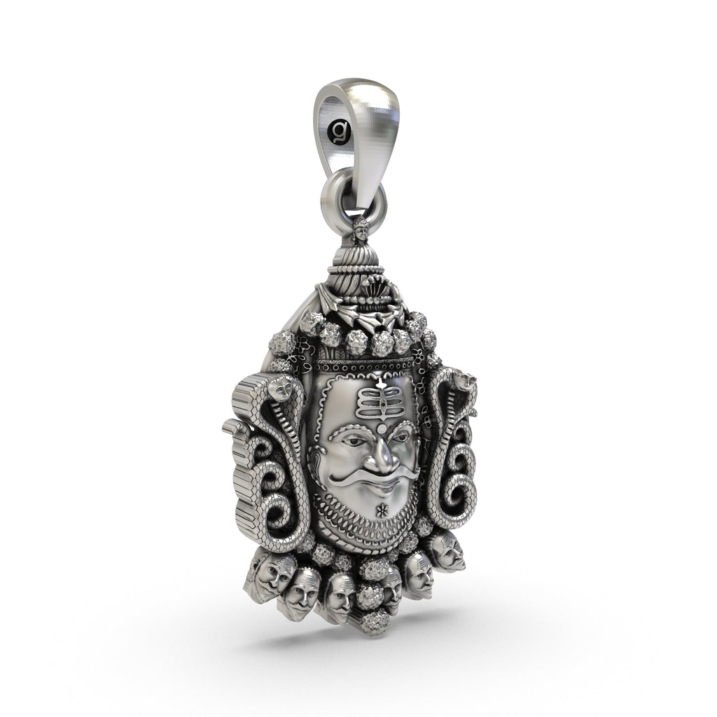 A close-up of the Silver Mahakal Pendant, focusing on the sacred symbols of Lord Shiva from the Ujjain temple.