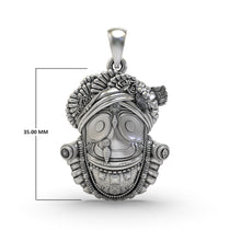 The sacred 925 sterling silver Jagannath pendant displayed on a textured surface, emphasizing its elegant appeal.