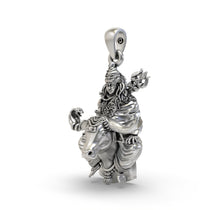 An angled side profile of the oxidised 925 silver Shiva on Nandi pendant, showing its dimensional form and hollow back.