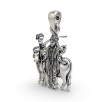 Angled shot of the oxidised silver Gatral Maa devi pendant, showing its sacred and intricate design.