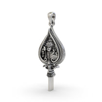 A close-up detail shot of the Murugan face on the 925 silver Vel spear amulet, highlighting the antique texture.