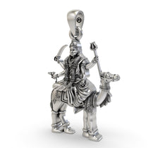 An angled side profile of the 925 sterling silver Momai Maa pendant, highlighting its antique oxidized finish and