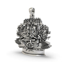 An angled side profile of the rare Ganda Bherunda Narasimha pendant, highlighting the intricate silver craftsmanship.