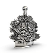 Close-up of the eight faces on the Ashta Mukha Ganda Bherunda pendant, showcasing the dark, antique oxidized details.