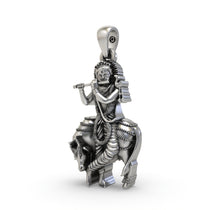 Close-up of the handcrafted 925 Sterling Silver Krishna with Cow locket, detailing the antique finish on the figures.