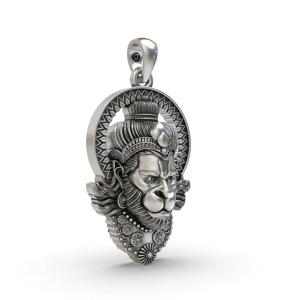 The 925 sterling silver Hanumanji face pendant held in hand to show its 35mm size and lightweight hollow back design.