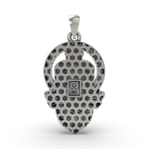 An angled view of the silver Hanumanji pendant, emphasizing the oxidized texture and the bail for wearing on a chain.