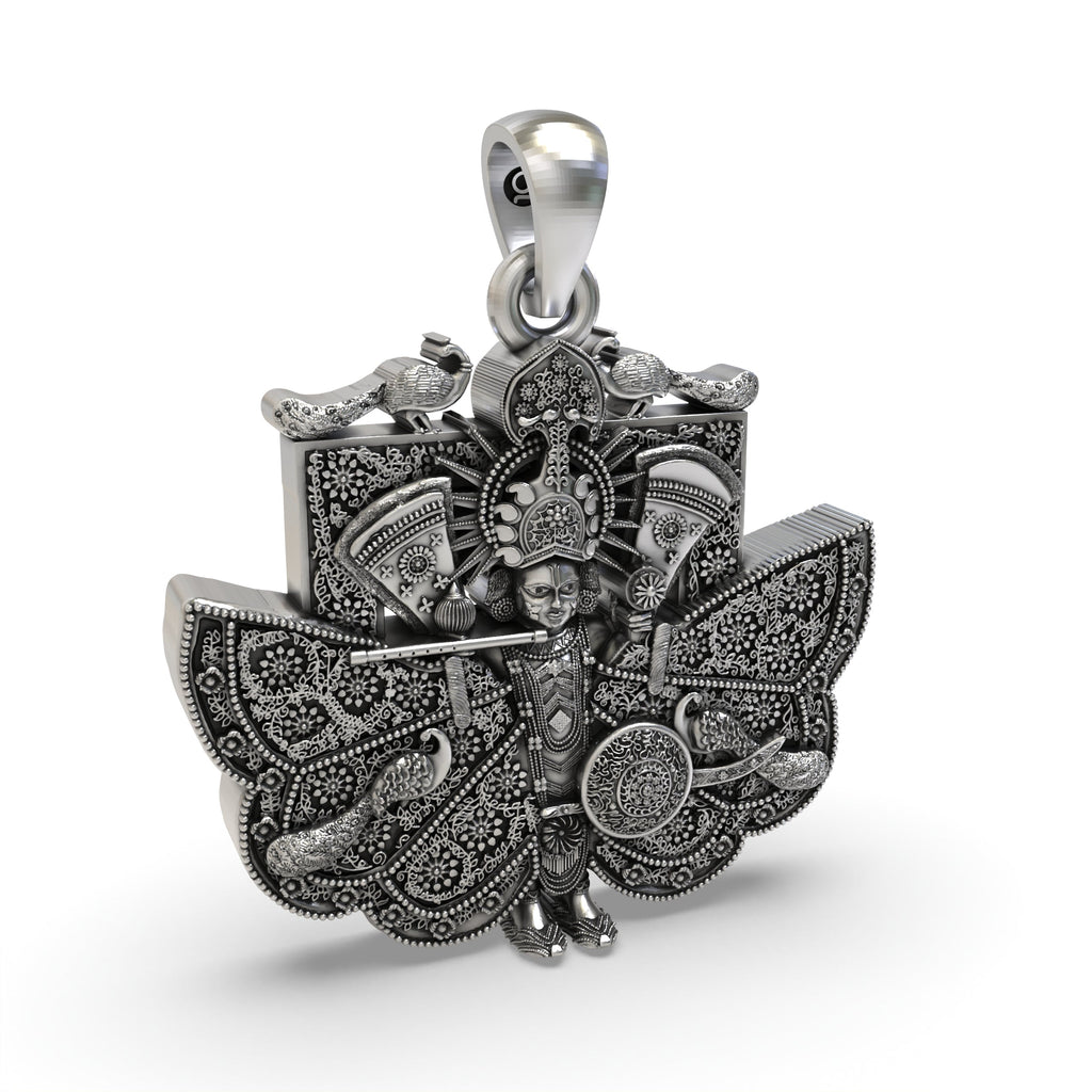 The spiritual Sanwariya Seth pendant in 925 oxidized silver held in hand to show its 32mm size and detailed work.