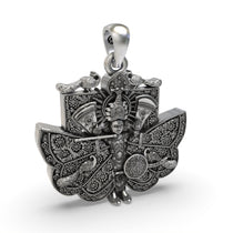 The spiritual Sanwariya Seth pendant in 925 oxidized silver held in hand to show its 32mm size and detailed work.