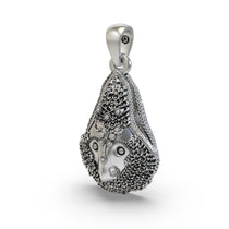 Side profile of the 925 silver Delhi Kali Maa pendant, revealing the hollow back design for lightweight comfort and wear.