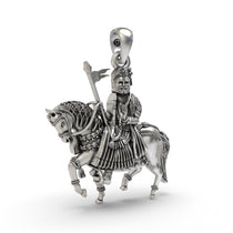 Close-up detail of the 925 silver Ramapir locket, emphasizing the intricate metalwork and the serene expression.