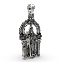Close-up detail on the face and staff of the Arulmigu Dhandayuthapani Swamy pendant in sterling silver.