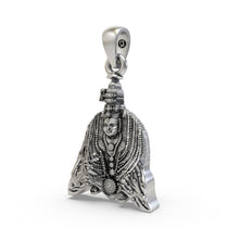 Angled shot of the sterling silver Tulja Bhavani pendant highlighting its traditional, antique finish.