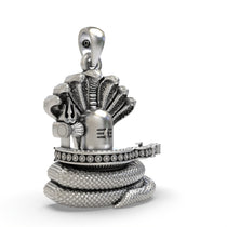 Close-up detail of the coiled Naga snake on the 925 silver Shiva Lingam spiritual amulet for spiritual seekers.